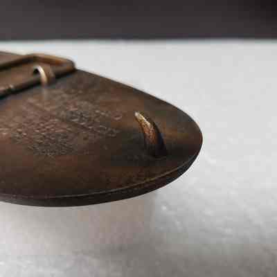 [Belt Buckle] Alberta Oilmen's Bonspiel Association, 1986, Antique-Bronze - Close-Up Hook: Angled close-up view of hook