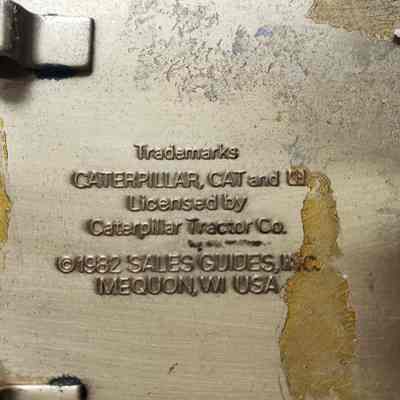 [Belt Buckle] CAT Diesel Power, 1982, Brass Black - Maker's Mark: Close-up view of the maker's mark on the back.