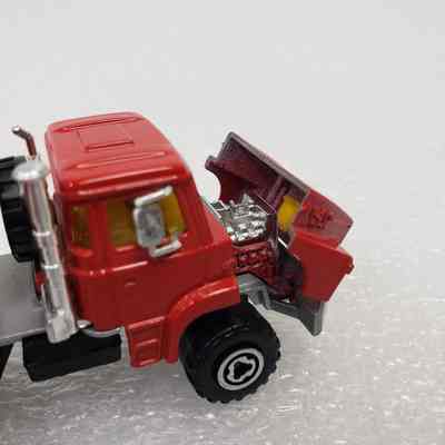 Close-up, back-left angle, truck cab, bonnet opened