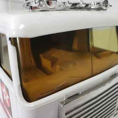 Close-up, truck interior through front windscreen, front-left angle