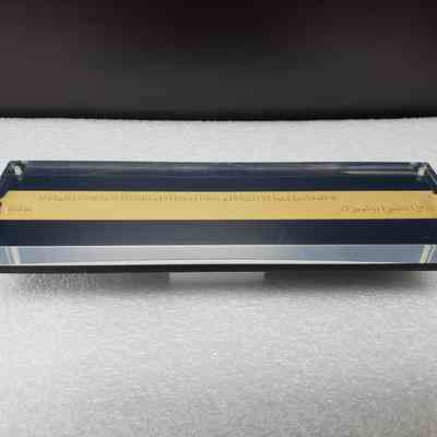 [Desk Plaque] Ticker Tape, "AMEX WELCOMES WESTBURNE...", Acrylic - Front, Angled: Angled view of front.