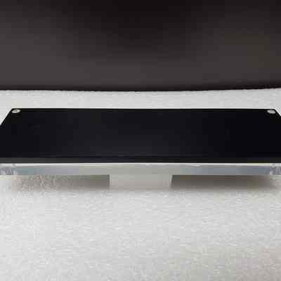 [Desk Plaque] Ticker Tape, "AMEX WELCOMES WESTBURNE...", Acrylic - Back: View of back.