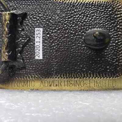 [Belt Buckle] Canan, Truck, Antique-Bronze - Maker's Mark: Close-up view of the maker's mark on the back.