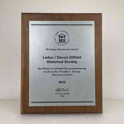 [Plaque] Heritage Awareness Award 2010, Alberta Historical Resources Foundation, Leduc / Devon Oilfield Historical Society, Metal on Wood