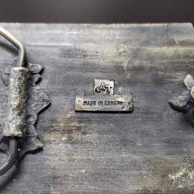 [Belt Buckle] Anderson Sand & Gravel Ltd. - Maker's Mark: Close-up view of maker's mark on back.