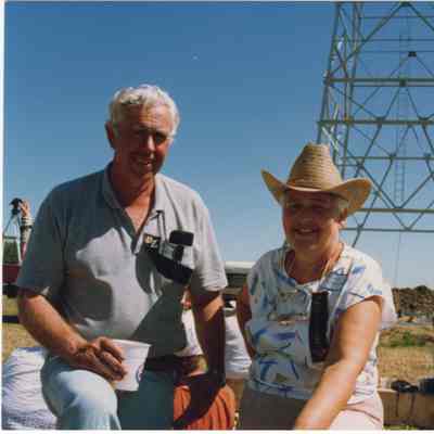 [Photo] Man and Woman In Front of Oil Rig, Colour, 4x6in