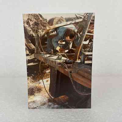 [Photo] Man Cutting Out Crown Section of Nabors' Rig 14-E, Nisku, Colour Portrait