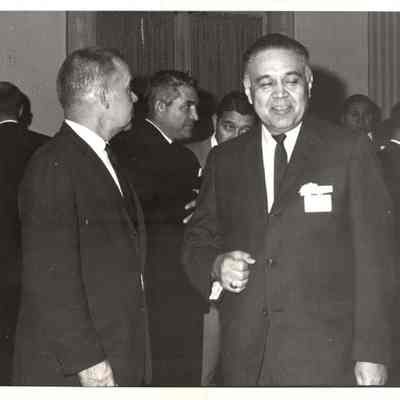 Robert Bennett standing in crowd of men