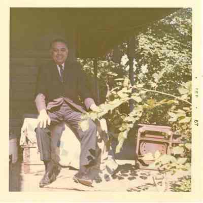 Robert Bennett sitting on a porch