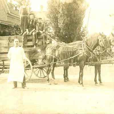 "Jim Hawley, Stockbridge" - Four men, a wagon, and two horses