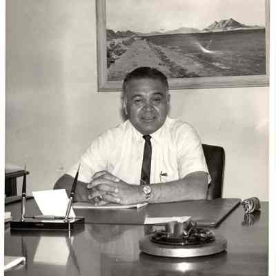 Robert Bennett behind desk
