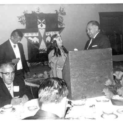 Robert Bennett with woman at podium