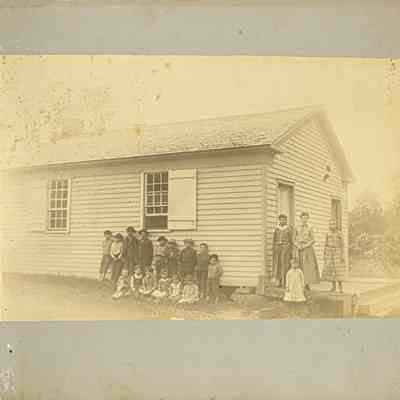 Group of children by building