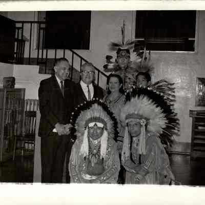 Robert Bennett with group dressed in regalia