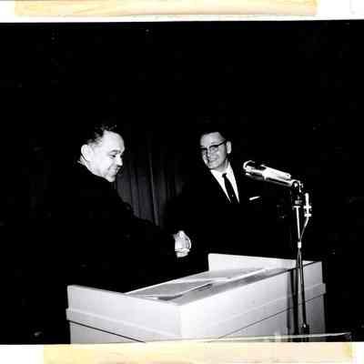 Robert Bennett shaking hands