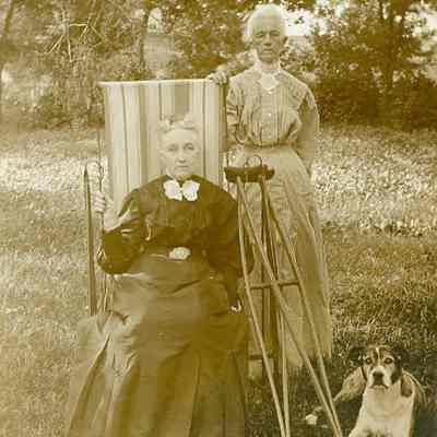 Two elderly women with dog