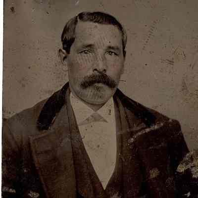 Man in three piece suit with a mustache