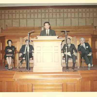 Man making a speech on a stage