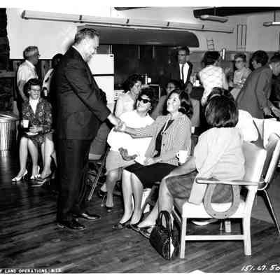 Robert Bennett greeting women