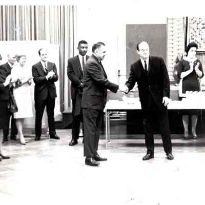 Robert Bennett shaking hands