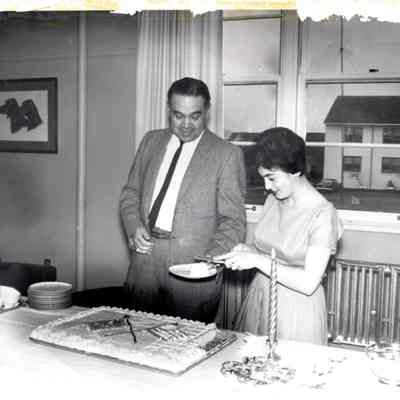 Robert Bennett serving cake