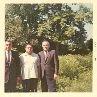 Robert Bennett and two men outside