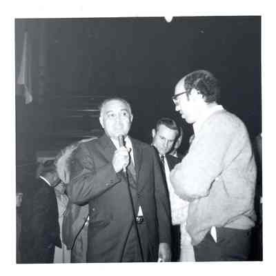 Bennett speaking into microphone
