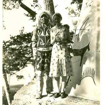 Man and woman in front of Tipi