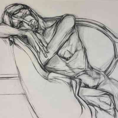 Kathee seated on the loveseat