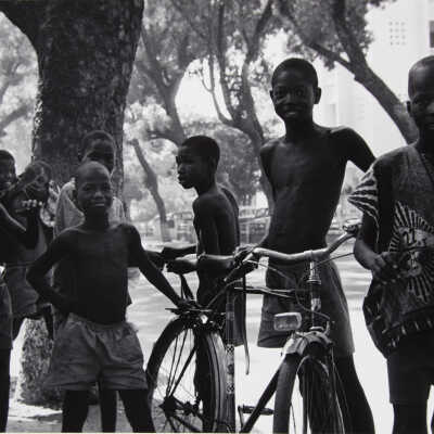 Untitled (children surrounding bicycle)