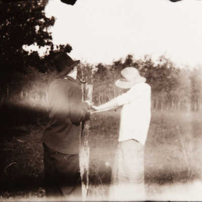 Man and Woman at Fence
