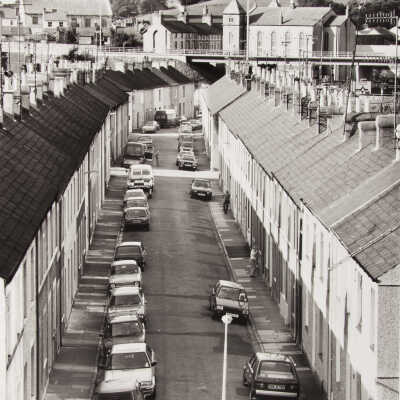 Untitled (UK Street scene w/ parked cars and castle)