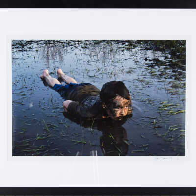 Boy Playing In Mud