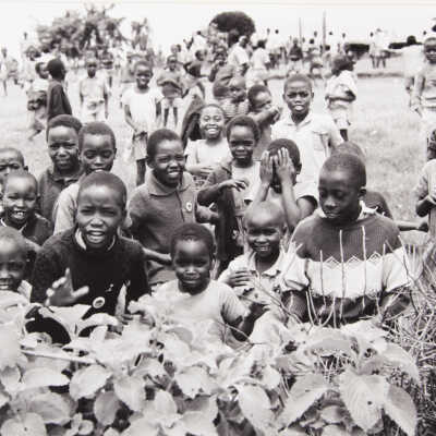 Untitled (large African-American group of children, near hedge)