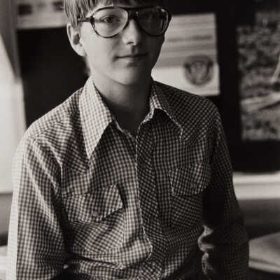 Untitled (boy w/ glasses in school class room)