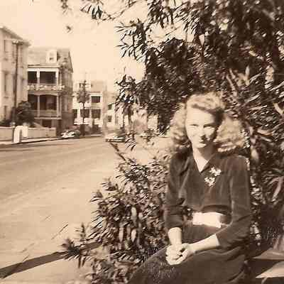 Woman Seated Across the Street From 93 Rutledge Avenue and 95 Rutledge Avenue
