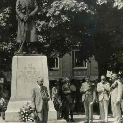 Memorial service around the base of The Sentinel in Washington Park: Copyright: yes; Origformat: Artifact