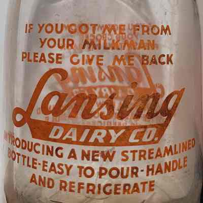 Lansing Dairy Co. Embossed and Pyro Squat-Neck Quart Bottle