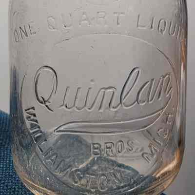 Quinlan Bros. Dairy Embossed Quart Bottle