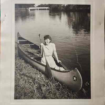 Woman in a Canoe in River Photo