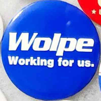 Wolpe Working for us. Button