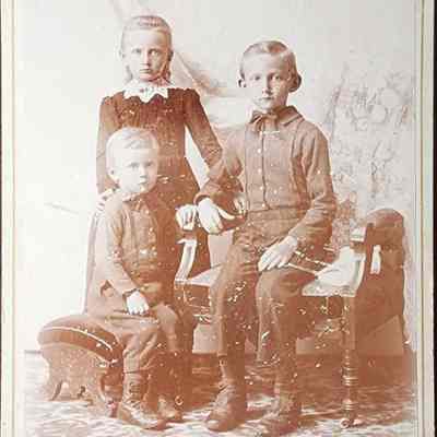 Portrait of Three Children Cabinet Card by Cheney