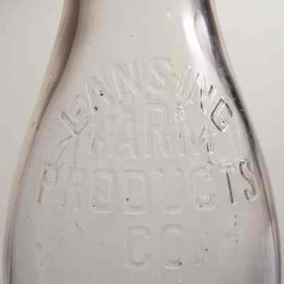 Lansing Farm Products Co. Embossed Squat Neck Quart Bottle