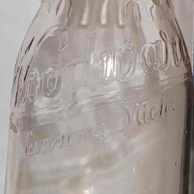 Woodward Dairy Embossed Quart Ridge-Neck Bottle