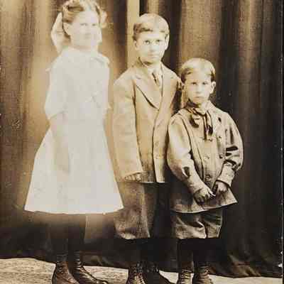 Audrey, Roy, and Walter Magnusson RPPC
