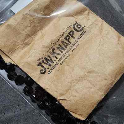 J.W. Knapp Beads in Advertising Sack