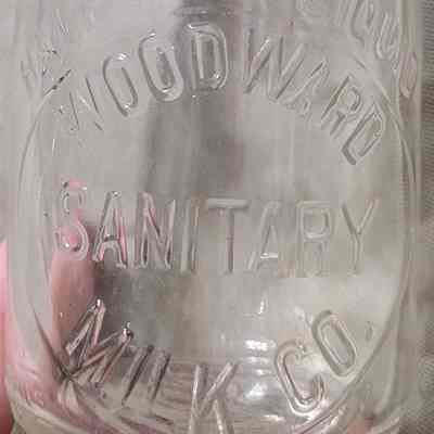 Woodward Sanitary Milk Co. Embossed Half Pint Bottle