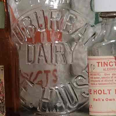 Suburban Dairy C.E. Hause Embossed Pint Bottle
