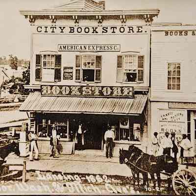 Lansing - 1862. S.E. Cor. Wash. and Mich. Ave's. RPPC by Bovee