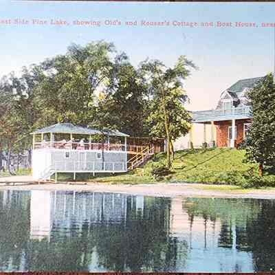 The Bluff on East Side Pine Lake, showing Old's and Rouser's Cottage and Boat House, near Lansing, Mich. Postcard